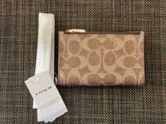 匿名配送新品未使用COACH ベージュ フラグメントケース