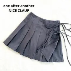 美品NICE CLAUPナイスクラップ　プリーツ巻きスカートミニスカート　リボンのサムネイル