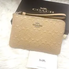 【未使用】COACH ポーチ シグネチャー エンボス加工 パテント ベージュ