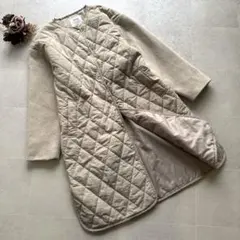 ikka【M】キルティングコート ベージュ ロング 切替 ノーカラー ゆったり
