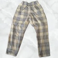 GU 140サイズ ベージュ系チェック長ズボン
