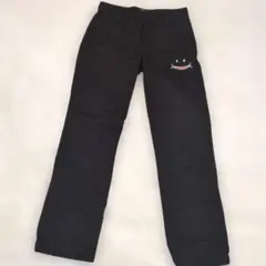 UP START 黒い笑顔刺繍パンツ