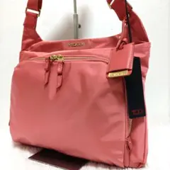 【極美品】TUMI トゥミ　ショルダーバッグ クロスボディ ゴールド金具 ピンクのサムネイル