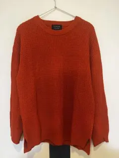 オレンジ 編み込みデザイン セーター
