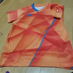 オレンジ 幾何学模様 卓球ウェア