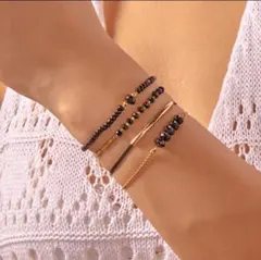 上品ゴールド＆ブラック ４連ブレスレット／アンクレット