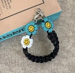 【再販】パラコード　ハンドスマホストラップ　☺︎ニコちゃん☺︎ お花　ハンドメイド