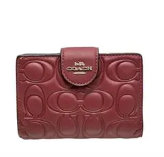COACHコーチシグネチャーミディアム二つ折り財布フューチャーピンク