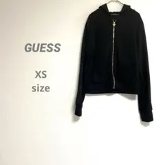 【ゲス】レディース コンパクトフードパーカー なめらか ブラック バックプリント