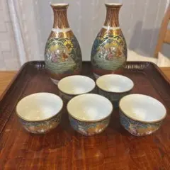 新品】九谷焼 大名行列 酒器 豪華金彩 徳利2本 盃9個 九谷色絵 金 酒盃