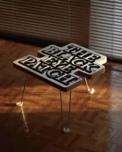 THE BLACK EYE PATCH OG LABEL TABLE