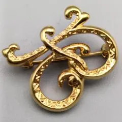 華麗なるアルファベットブローチ ～金彩に刻まれし優雅な[R]曲線～