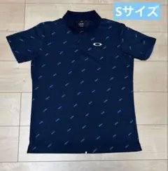 OAKLEY ポロシャツ ブラック 総柄 US S JPN M - メルカリ