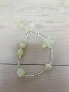 イエロービーズストラップ 花モチーフ