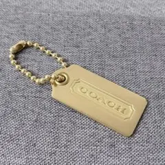 COACH コーチ チャーム キーホルダー ゴールドカラー　メタルタグ
