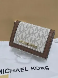 マイケルコースJET SET TRAVEL トライフォールドジップウォレット