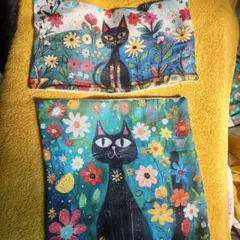 黒猫と花のクッション