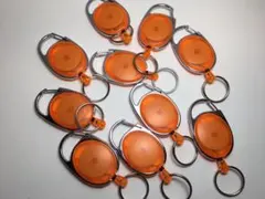 【10個セット】カラビナ付リールキーホルダー（クリアオレンジ）
