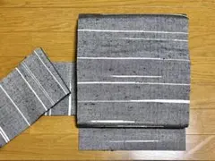 九寸名古屋帯 米沢紬 正絹 カジュアル 新古品 グレー 灰色 高級 yzk633