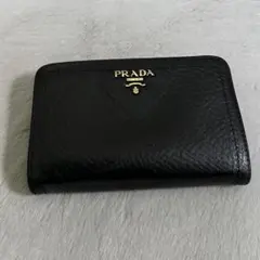 PRADA プラダ　折り財布　ラウンドジップ　シボ革　ゴールドロゴ　ブラック