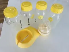 medela 哺乳瓶4本、カーム1、ホルダー　セット