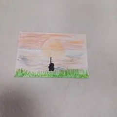 「 夕日のとき水切りをする人」