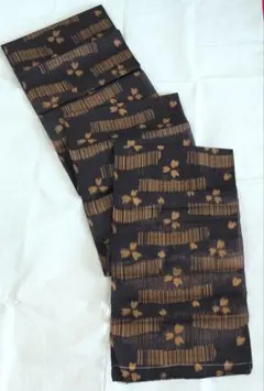 【紬】小紋反物　炭黒×マスタード小花絣のサムネイル