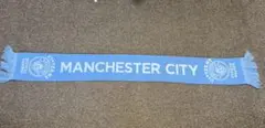 マンチェスターシティのタオルマフラーとピンバッチのセット