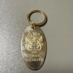 金色の「THE STOCK EXCHANGE」キーホルダー