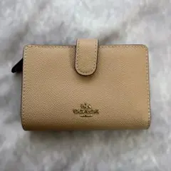 コーチ　コンパクトウォレット　二つ折り財布　コーナージップ　ミディアム　ベージュ