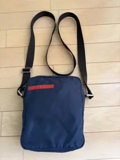 「値下げ」PRADA SPORTSショルダーバッグ ネイビー 2026年最新】プラダスポーツ バッグの人気アイテム - メルカリ