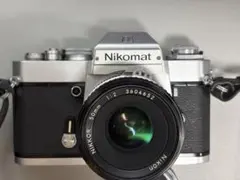 Nikomat フィルム一眼レフカメラ Nikkor 50mm f/2 作動のサムネイル