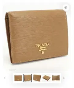 PRADA 二つ折り財布 レザー ベージュ ゴールドロゴのサムネイル