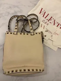 VALENTINO スタッズ ショルダーバッグ 巾着綺麗なイエロー - メルカリ