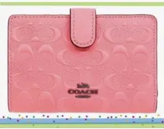 COACHコーチシグネチャーパウダーピンクミディアム二つ折り財布 - メルカリ