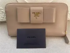 プラダ 長財布 フィオッコ サフィアーノ ベージュ メタルロゴ リボン