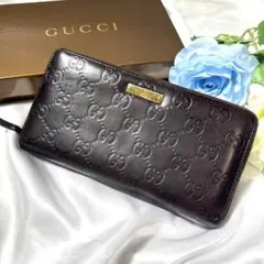 GUCClグッチ ラウンドファスナー GGシマ ロゴプレート ブラウン