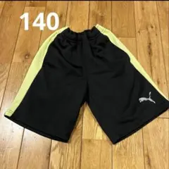 140 PUMA 黒/黄 ショートパンツ プーマ　 半ズボン　ジャージ