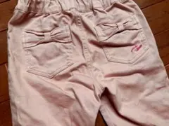 リボン付きピンクスリムフィットパンツ