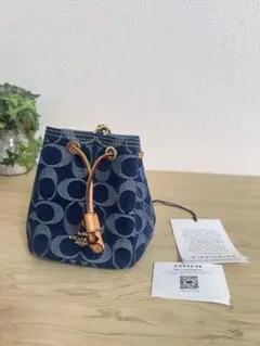 コーチ　デニム　シグネチャー　ドローストリングリストレット