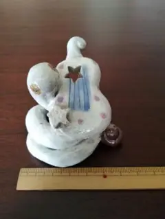 チェロを弾くヘビ　 置物　陶器製
