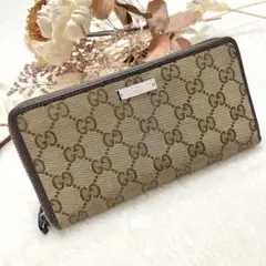 美品✨️グッチ 長財布 GGキャンバス フラップ ロゴプレート レザー 