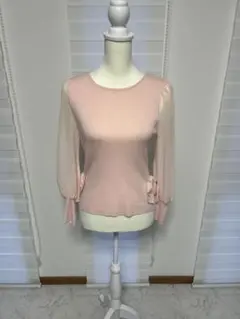 リボン付きピンクニットトップス