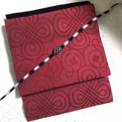 ヴィンテージ￼正絹名古屋帯　緋色にぐるぐる抽象模様