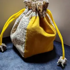 ハンドメイド】ミナペルホネン tambourine使用 イエロー巾着ポーチ