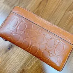 coachオレンジレザー エンボスロゴ 長財布
