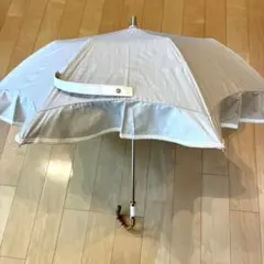 グレイシー　持ち手付き　フリルたっぷり　晴雨兼用日傘　ベージュ グレイシー 持ち手付き フリルたっぷり 晴雨兼用日傘 ベージュ - メルカリ