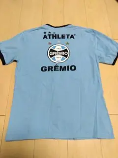 グレミオ ATHLETA 水色シャツ Mサイズ