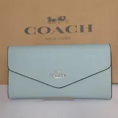 コーチ COACH 財布　エンベロープ ウォレットシグネチャー キャンバス　水色