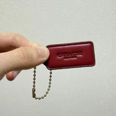 送料込み　COACH レザー 赤 タグ型キーホルダー